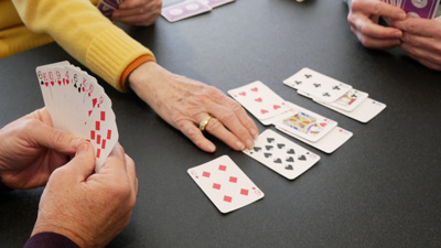 SAGE Bridge club photo of hands and cards